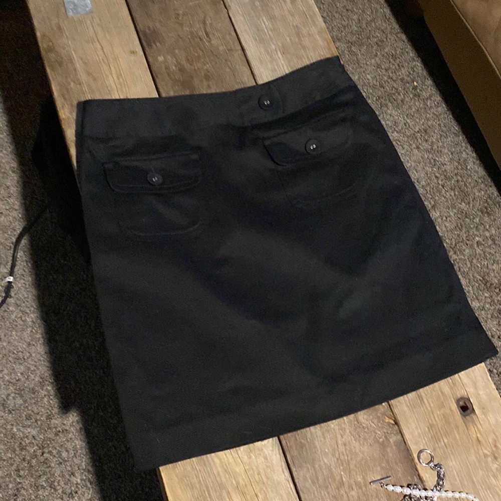 Never worn black Ann Taylor Loft mini skirt. Size 2.